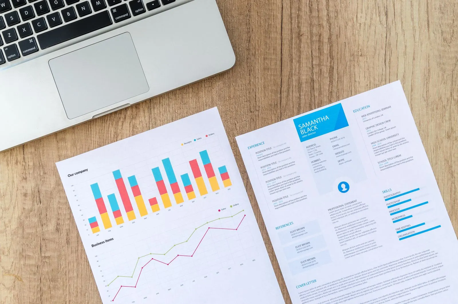 Growth charts next to a laptop